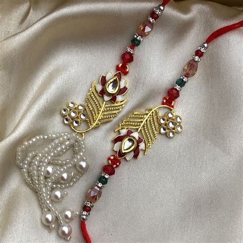 Wonderful Red Stone Gold Designer Bhaiya Bhabhi Rakhi Set Buy Online