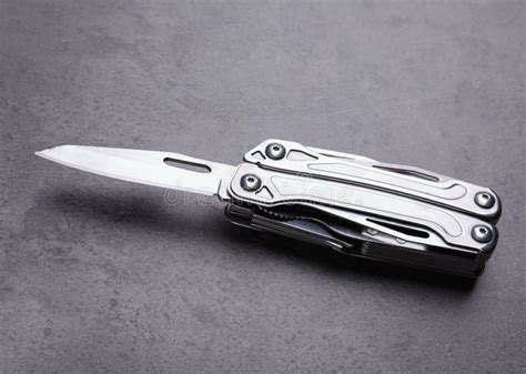 Modern Compact Portable Multitool On Grey Table Stock Image Image Of