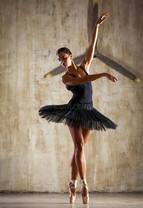 Full Body Portrait. Russian Ballerina in a Black Dancing Suit is Posing ...