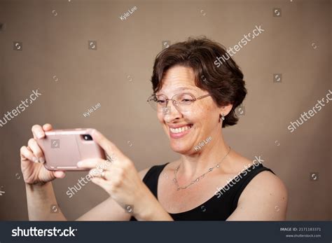 Attractive Mature Woman On Her Phone Stock Photo Shutterstock