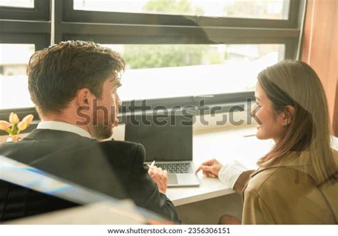 Happy Business People Thinking While Collaborating Stock Photo