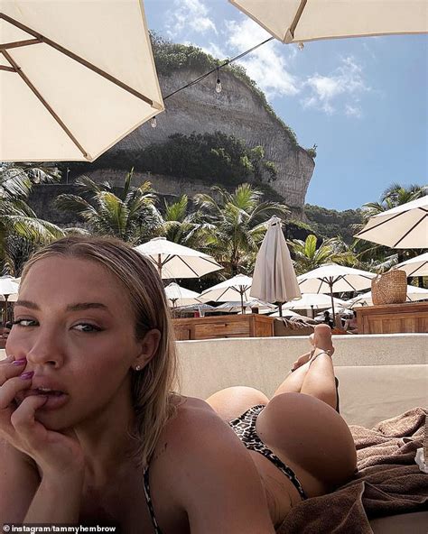 Tammy Hembrow shows off her famous derrière in skimpy animal print bikini as she continues