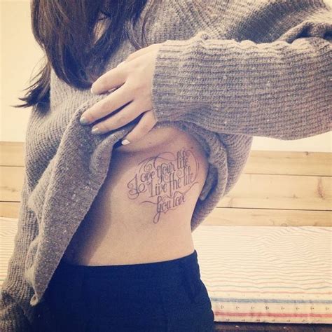 "Love your life, live the life you love" tattoo on the