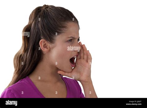 Angry Girl Screaming Against A White Background Stock Photo Alamy