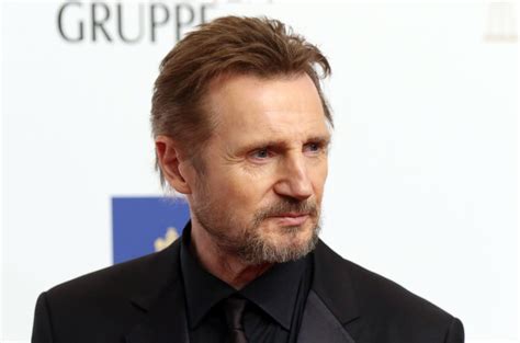 Liam Neeson Suits Up For ‘Men In Black’ Spinoff