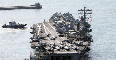 U.S. aircraft carrier arrives in South Korea as North’s Kim Jong Un exchanges messages with Putin