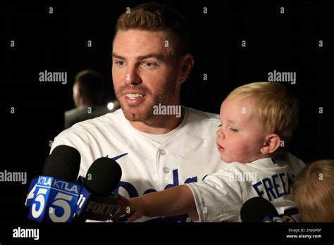 Los Angeles Dodgers First Baseman Freddie Freeman Holds Son Brandon