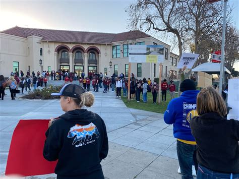 Protesters outside Wilson High urge students to ditch their masks
