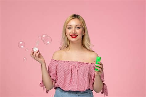 Free Photo Cute Girl Adorable Blonde Chick With Red Lipstick In Pink Blouse With Soap Bubbles