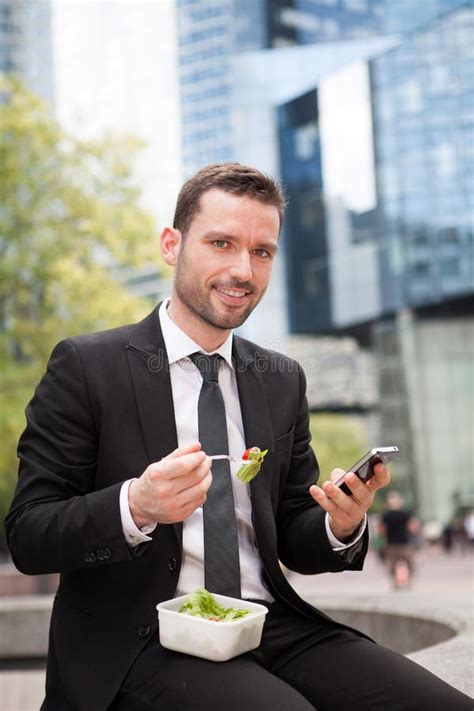 Businessman Eating Sandwich For Lunch Break Stock Photo Image Of