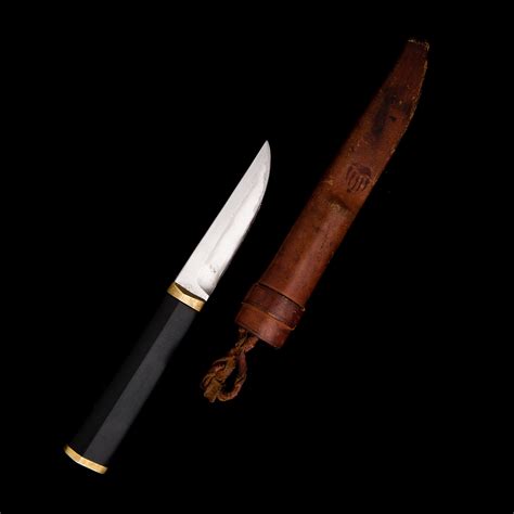 A Finnish Puukko Knife In Stainless Steel Nylon And Brass Designed By