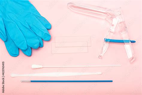 Disposable Gynecological Examination Kit On A Pink Background