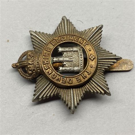 Ww1 Ww2 British Army The Devonshire Regiment White Metal And Brass Cap The Militaria Shop