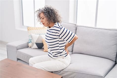 Premium Photo Middle Age Grey Haired Woman Suffering For Backache