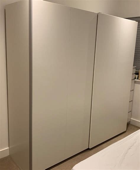 White PAX Ikea Wardrobe 200x201 With White Hasvik Sliding Doors In