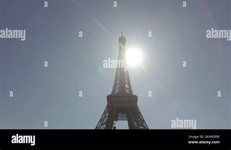 Underneath The Eiffel Tower In Paris France With The Sun Behind Lens