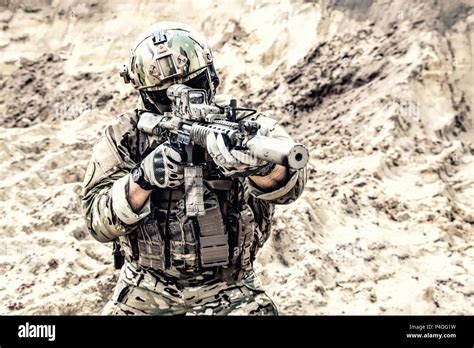 Modern Army Soldier Aiming And Shooting In Desert Stock Photo Alamy