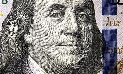 Premium Photo | Macro view of 100 us dollar bill benjamin franklin portrait