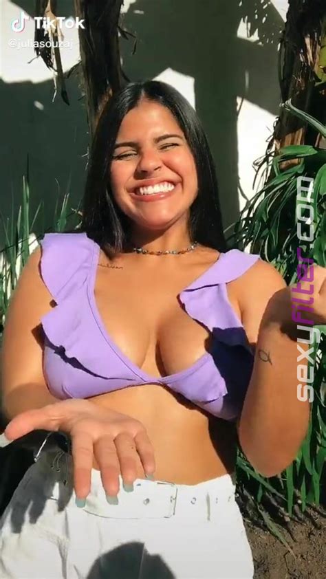 Julia Antunes Shows Cleavage In Appealing Purple Bikini Top