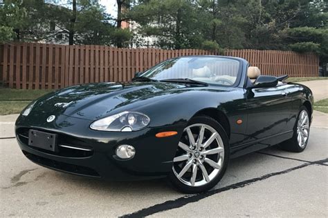 This 2006 Jaguar XK8 convertible is finished in green over tan leather ...