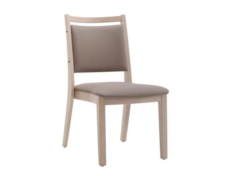 The Back Side Of A Chair With A Beige Upholstered Seat