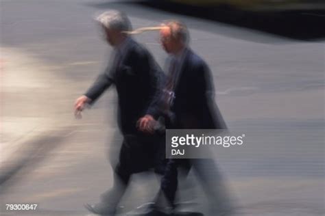 Two Men Walking Side By Side High Angle View Blurred Motion New York City Ny Usa High Res Stock