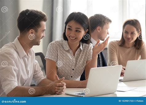 Happy Diverse Employees Talking Laughing Working Together With