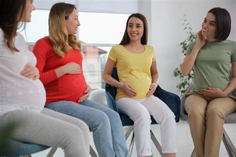 Group Of Pregnant Women At Courses For Expectant Mothers Indoors Stock