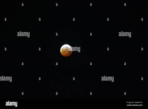 Bright full moon isolated in the dark night sky Stock Photo - Alamy