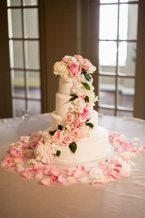 White Buttercream Cake With Cascading Blush And Ivory Flowers Wedding