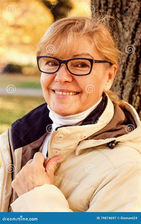 Cute Mature Woman Smiling Portrait On Black Background Royalty Free Stock Photo CartoonDealer