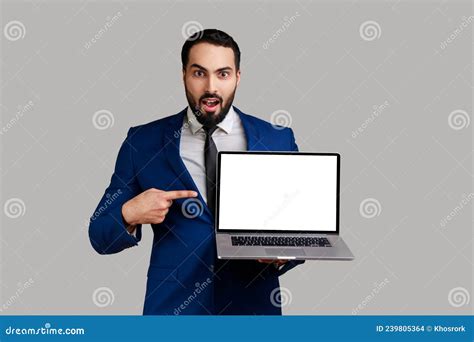 Man Pointing At Laptop With Blank Display Showing Empty Screen Amazed