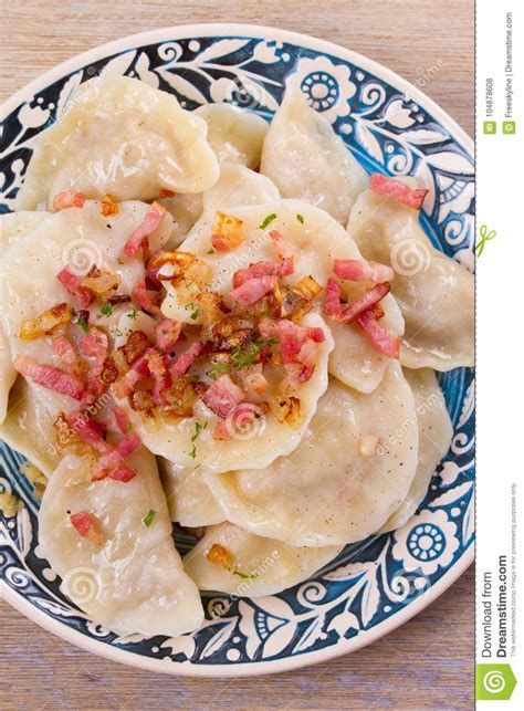 Dumplings Filled With Cabbage And Served With Fried Bacon And Onion