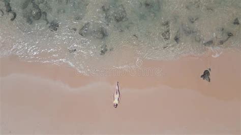 Caucasian Woman In A Bikini Lying On The Seashore On Vacation Stock Footage Video Of Woman