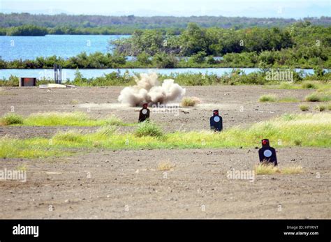 An impact explosion from a 203 grenade launcher hits the ground during ...