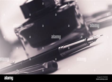 Fountain Pen and the Black Ink Bottle. Writing Concept Stock Photo - Alamy