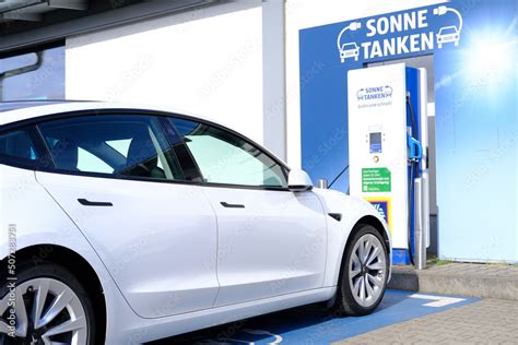 FRANKFURT, Germany - May 2022: supermarket aldi, Tesla passenger ...