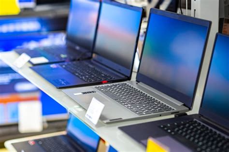 Premium Photo A Sample Of Laptops In A Shop Window Behind Glass On A