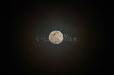 Moon with Halo in Clouds stock image. Image of night - 193923183