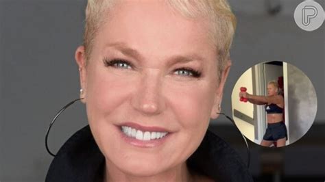 Xuxa pega pesado em treino deixa barriga sarada à mostra e ganha