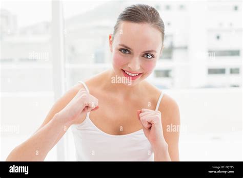 Fit Brunette Putting Her Fists Up Stock Photo Alamy