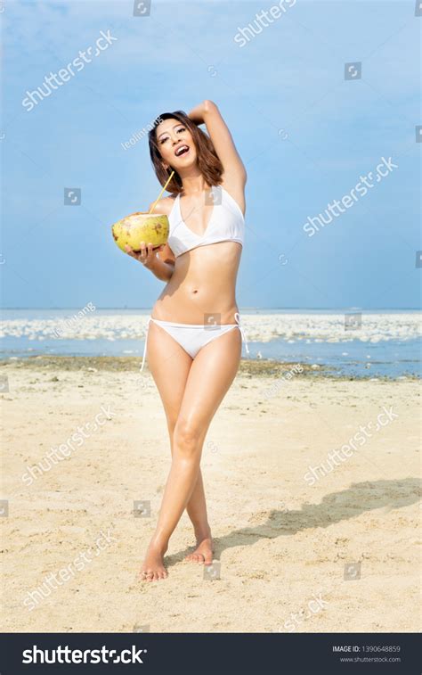 Asian Sexy Girl Bikini Holding Coconuts Stock Photo 1390648859 Shutterstock