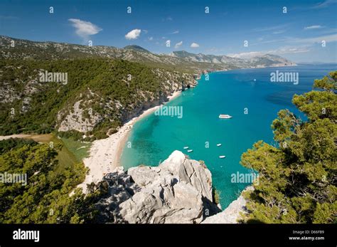 Panoramic View Of Cala Luna Beach With The Clear Blue Sea And The Wild