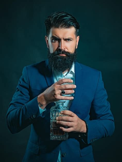 Premium Photo Bearded Businessman In Elegant Suit With Glass Of