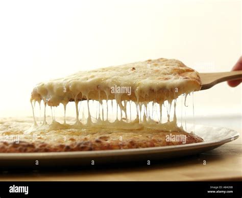 Lifting A Slice Of Cheese Pizza Stock Photo Alamy