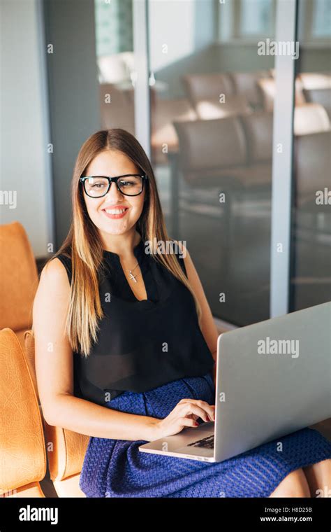 Beautiful Smiling Businesswoman Is Using A Laptop Stock Photo Alamy