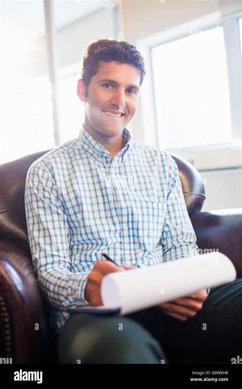 Man Writing On Clipboard Stock Photo Alamy