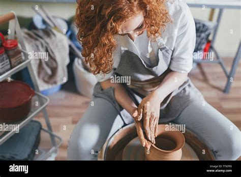 Female Potter Making Pot With Clay In Workshop Stock Photo Alamy