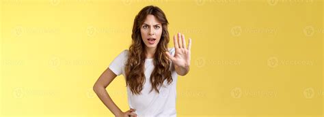 Stop right there fashion police. Serious-looking confident young curly