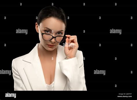 Lady boss. Successful Caucasian woman in glasses and white suit as a ...
